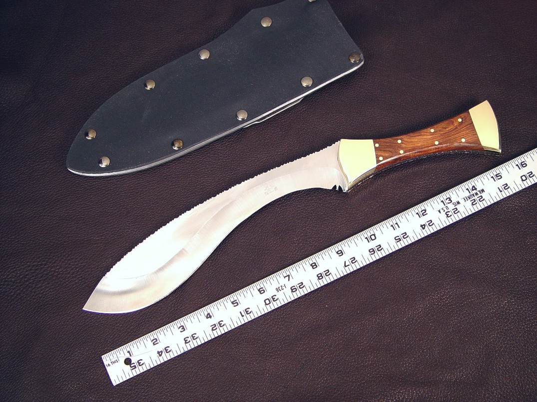 "Nasmyth-Marius" handmade custom khukri, obverse side view in satin finished 440C high chromium stainless steel blade, naval brass bolsters and pins, Honduras Rosewood hardwood handle, kydex, aluminum, blued steel sheath