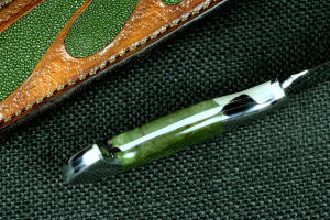 "Opere" Custom Knife,inside handle tang view in T4 cryogenically treated CPM 154CM powder metal stainless steel blade, 304 stainless steel bolsters, Nephrite Jade gemstone handle, hand-carved leather sheath inlaid with green rayskin